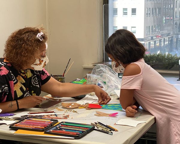 Student paper doll design project in kids art classes NYC